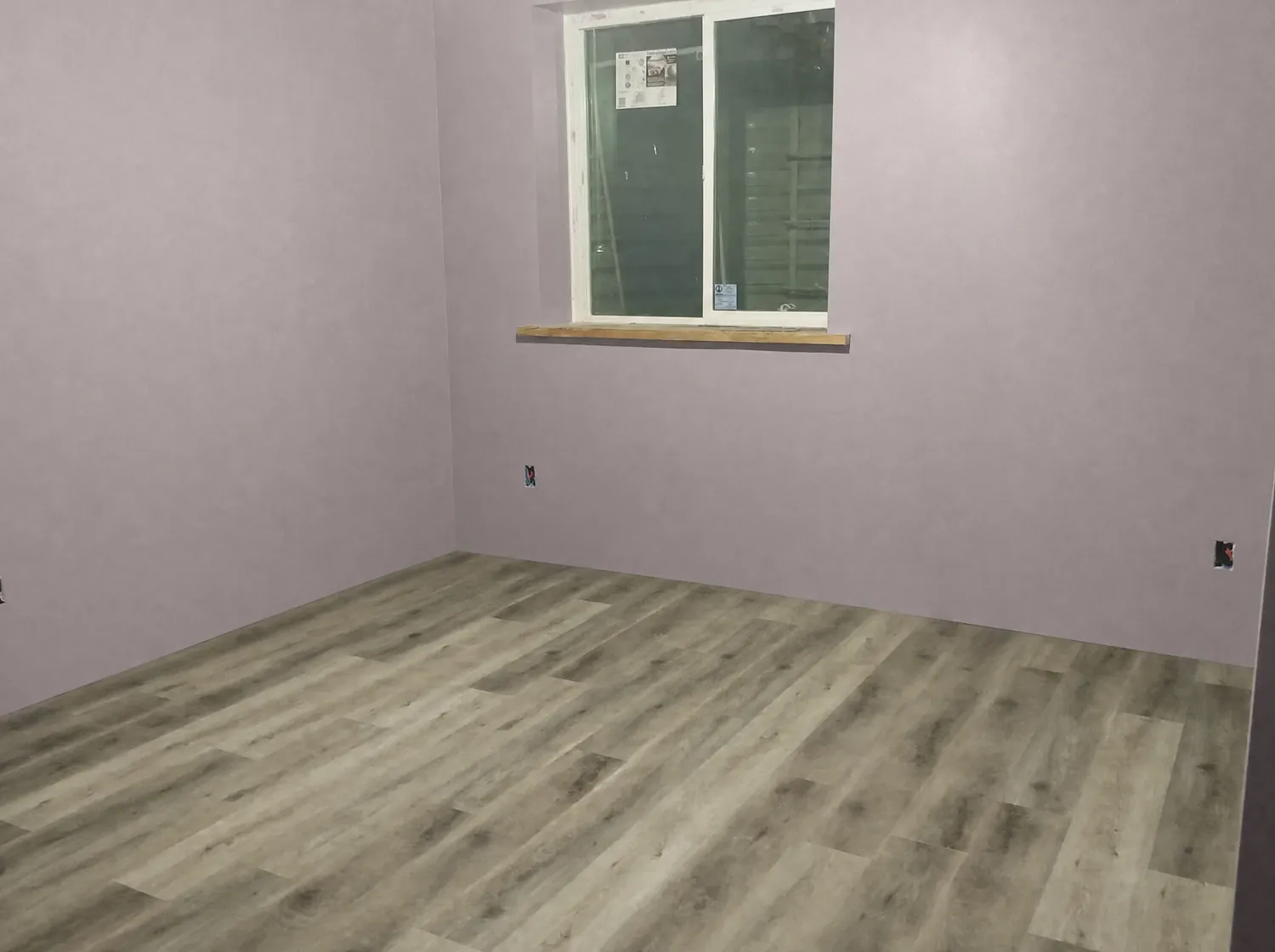 Finished room with fresh paint and new plank flooring